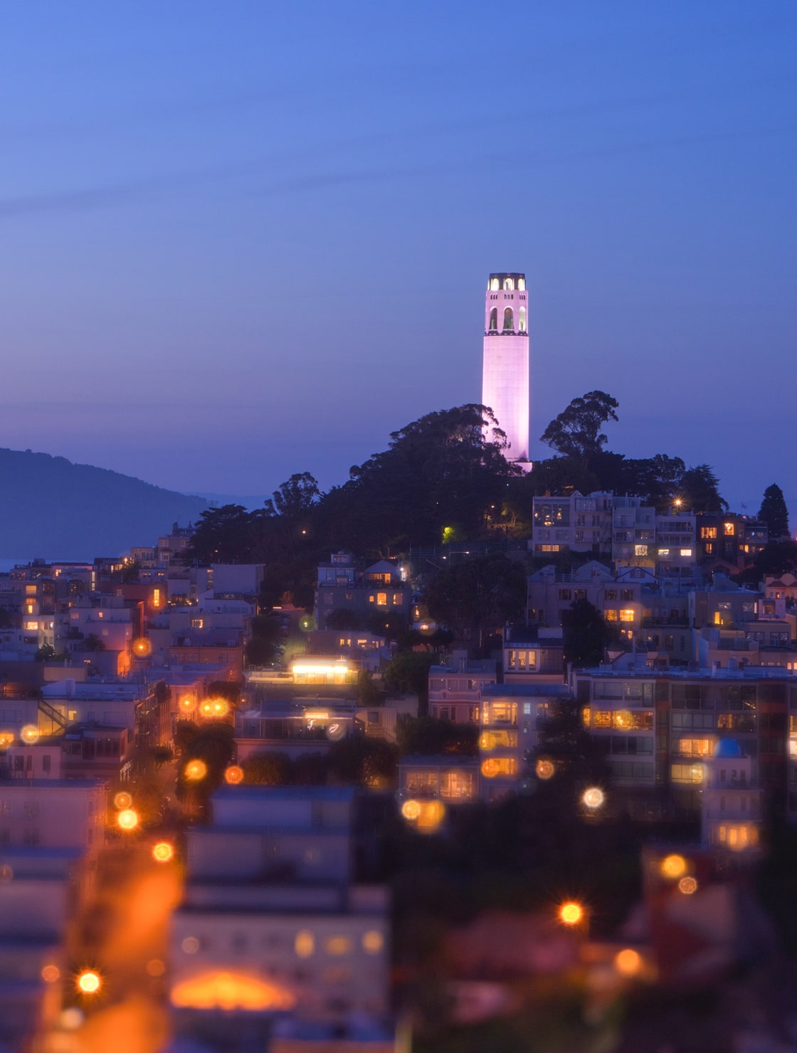 A view of Coit Tower at dusk